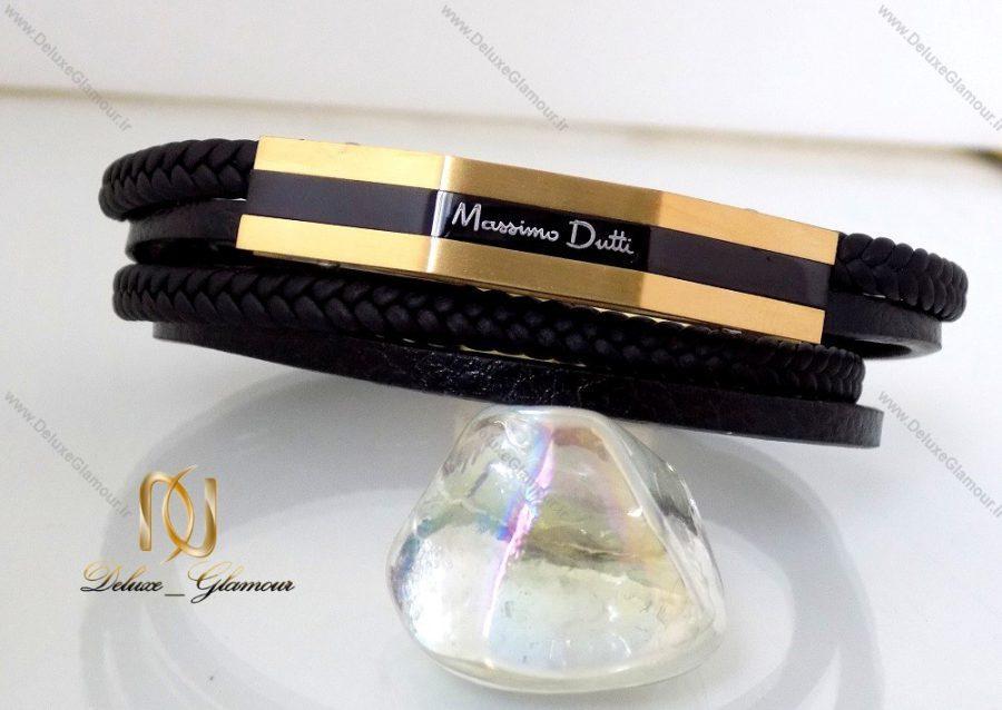 دستبند چرمی massimo dutti چند ردیفه مردانه مشکی-طلایی ds-n145 بر روی سنگ