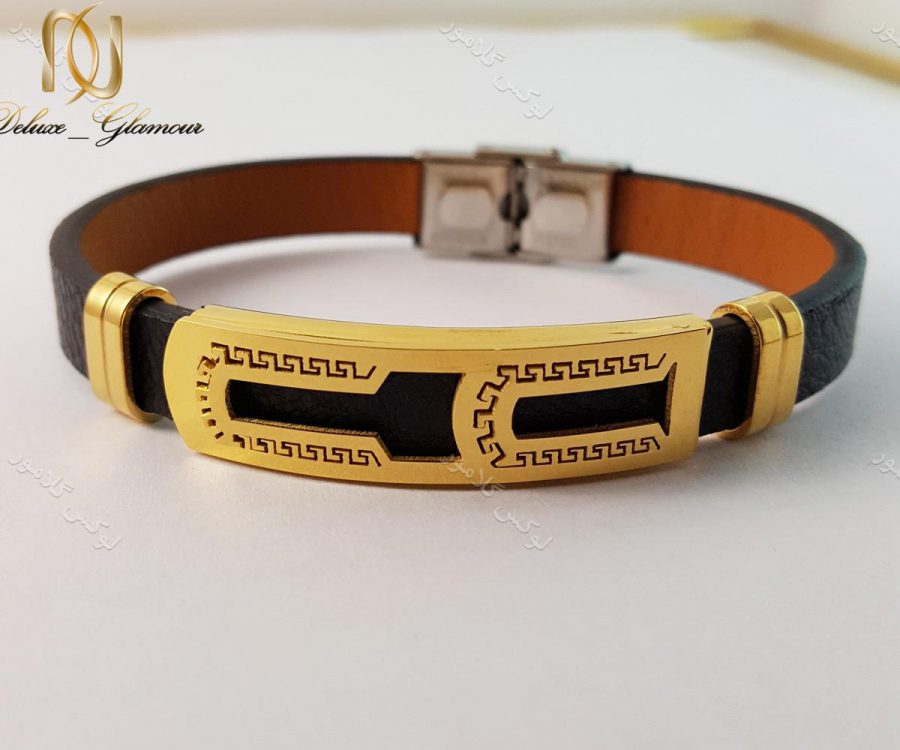 دستبند چرمی مردانه یک ردیفه مشکی طلایی قفل جعبه ای ch-103 روی زمین