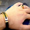 نیم ست دستبند و انگشتر مردانه طلایی و مشکی ns-n208 از نمای روی دست